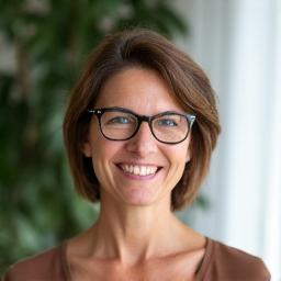 Portrait of Elena Rodriguez, a warm and approachable woman, smiling