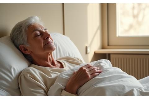 Senior adult waking up refreshed in organic bedding