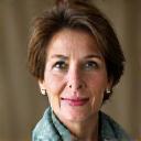 Portrait of Dr. Elara Vance, a warm and knowledgeable woman with an artisanal fabric scarf