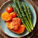 A balanced and colorful meal on an artisan plate, featuring fresh vegetables, lean protein, and whole grains, emphasizing mature adult nutrition